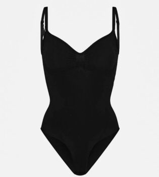 Contour Essentials Bodysuit in black with seamless, sculpting design. Perfect for layering or as a bold, elegant statement piece.